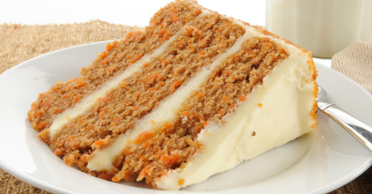 image of a slice of carrot cake laying on a white plate for savory and sweet recipes blog post.